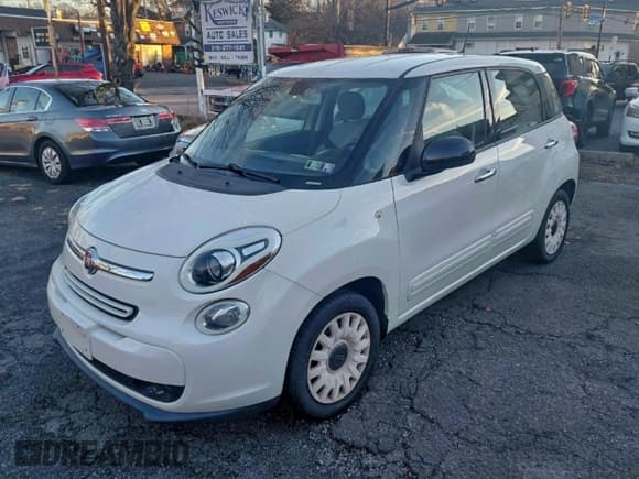 ✅ 2014 FIAT 500L Pop • VIN: ZFBCFAAHXEZ004049 • Лот: 95756405. Опубликован ранее на Copart с пробегом 136 801 миль. Бесплатный доступ к архиву аукционных продаж из США и подробный отчёт об истории автомобиля на DreamBid. Изображение 2.