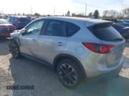 ✅ 2016 Mazda CX-5 Grand Touring • VIN: JM3KE2DY8G0604998 • Lot: 43696169. Listed on IAAI with 104,349 mi. Free auction sales archive from the USA and detailed vehicle history report at DreamBid. Image 3.