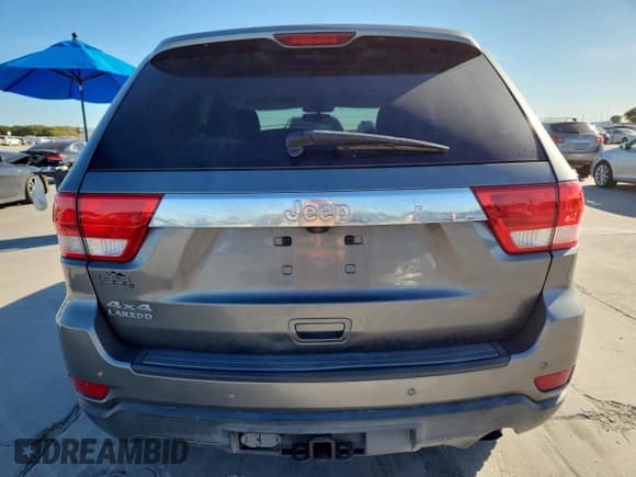 ✅ 2013 Jeep Grand Cherokee Laredo • VIN: 1C4RJFAG8DC529042 • Lot: 82599485. Listed on Copart with 119,884 mi. Free auction sales archive from the USA and detailed vehicle history report at DreamBid. Image 6.