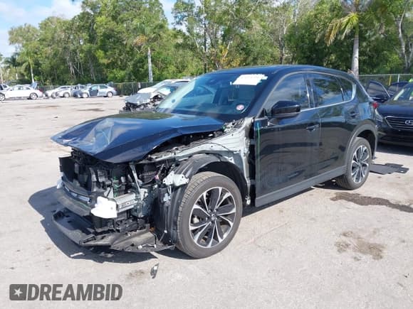 ✅ 2022 Mazda CX-5 S Premium • VIN: JM3KFBDMXN0620059 • Lot: 42114798. Listed on IAAI with 19,602 mi. Free auction sales archive from the USA and detailed vehicle history report at DreamBid. Image 2.