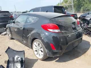 2014 Hyundai Veloster z VIN KMHTC6AD2EU214301, wystawiony jako IAAI lot #43016517 z przebiegiem 122 845 mil mil oraz . Historia ofert i sprzedaży dostępna na DreamBid. Obrazek 3.