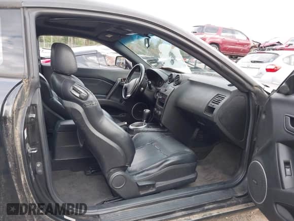 2003 Hyundai Tiburon GT with VIN KMHHN65F53U059705, listed as a IAAI auction lot 43573043 with 165,650 mi miles and . Bid and sale history available at DreamBid. Image 5.