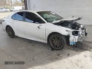 2023 Toyota Camry SE with VIN 4T1G11BK2PU099094, listed as a IAAI auction lot 41403372 with 57,261 mi miles and . Bid and sale history available at DreamBid. Image 1.