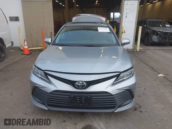 2022 Toyota Camry LE with VIN 4T1R11BKXNU066513, listed as a IAAI auction lot 41324509 with 19,488 mi miles and . Bid and sale history available at DreamBid. Image 7.