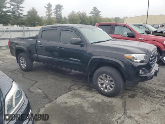 ✅ 2018 Toyota Tacoma TRD Off Road • VIN: 3TMDZ5BNXJM044910 • Lot: 80719065. Listed on Copart with 71,428 mi. Free auction sales archive from the USA and detailed vehicle history report at DreamBid. Image 4.