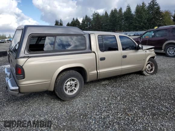 2002 Dodge Dakota SLT с VIN 1B7HL48N02S607590, выставлен на аукционе Copart как лот 78642324 с пробегом 209 081 миль миль и Списание • Salvage title. История ставок и продаж доступна на DreamBid. Изображение 3.