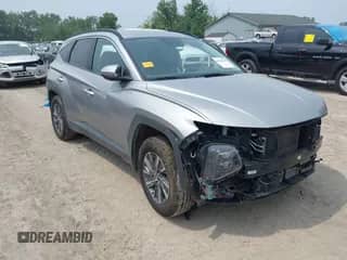 2022 Hyundai Tucson Blue z VIN KM8JBCA1XNU077977, wystawiony jako IAAI lot #42868058 z przebiegiem 76 081 mil mil oraz . Historia ofert i sprzedaży dostępna na DreamBid. Obrazek 1.