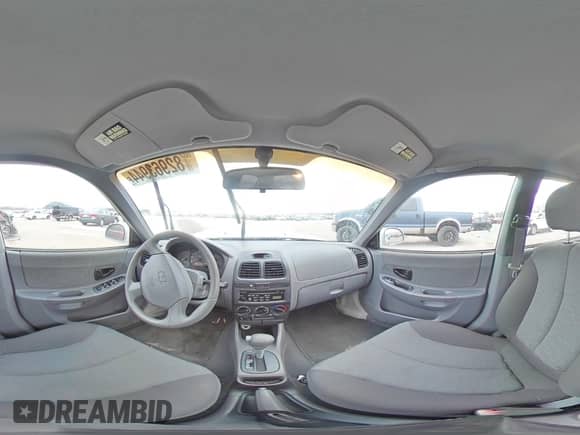 2004 Hyundai Accent GL z VIN KMHCG45C94U564176, wystawiony jako Copart lot #82963944 z przebiegiem 454 400 mil mil oraz Szkoda całkowita • Salvage title. Historia ofert i sprzedaży dostępna na DreamBid. Obrazek 13.