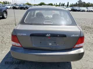 2002 Hyundai Accent z VIN KMHCF35G32U206522, wystawiony jako Copart lot #62509445 z przebiegiem 147 183 mil mil oraz Szkoda całkowita • Salvage title. Historia ofert i sprzedaży dostępna na DreamBid. Obrazek 6.