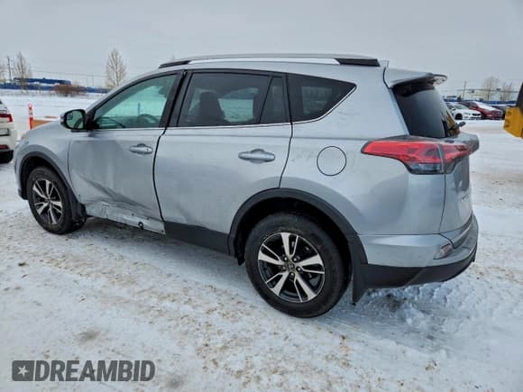 ✅ 2018 Toyota RAV4 LE • VIN: 2T3BFREV4JW802399 • Lot: 94268425. Listed on Copart with 114,198 mi. Free auction sales archive from the USA and detailed vehicle history report at DreamBid. Image 2.