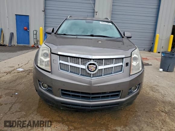 ✅ 2012 Cadillac SRX Performance Collection • VIN: 3GYFNBE37CS532590 • Lot: 94237585. Listed on Copart with 166,412 mi. Free auction sales archive from the USA and detailed vehicle history report at DreamBid. Image 5.
