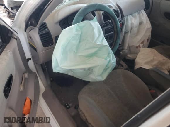 2005 Hyundai Accent GLS z VIN KMHCG45C65U661496, wystawiony jako Copart lot #55171545 z przebiegiem 137 514 mil mil oraz Szkoda całkowita • Salvage title. Historia ofert i sprzedaży dostępna na DreamBid. Obrazek 8.