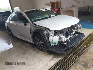 2022 Toyota Camry SE with VIN 4T1T11AK5NU059881, listed as a IAAI auction lot 42915288 with 100,000 mi miles and . Bid and sale history available at DreamBid. Image 1.