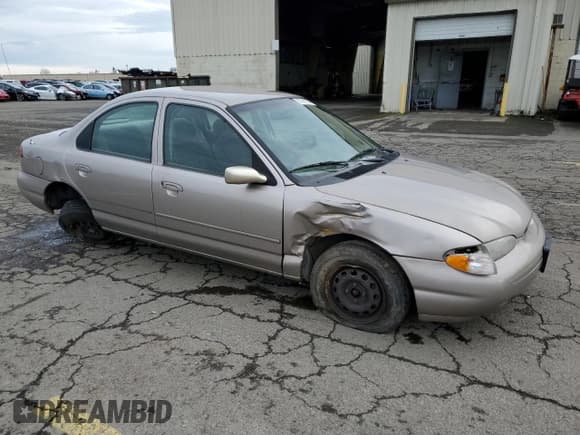 ✅ 1996 Ford Contour • VIN: 3FALP6535TM129390 • Лот: 73338064. Опубликован ранее на Copart с пробегом 87 588 миль. Бесплатный доступ к архиву аукционных продаж из США и подробный отчёт об истории автомобиля на DreamBid. Изображение 4.