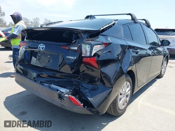 ✅ 2021 Toyota Prius L Eco • VIN: JTDKAMFU2M3150994 • Lot: 42760734. Listed on IAAI with 85,235 mi. Free auction sales archive from the USA and detailed vehicle history report at DreamBid. Image 4.