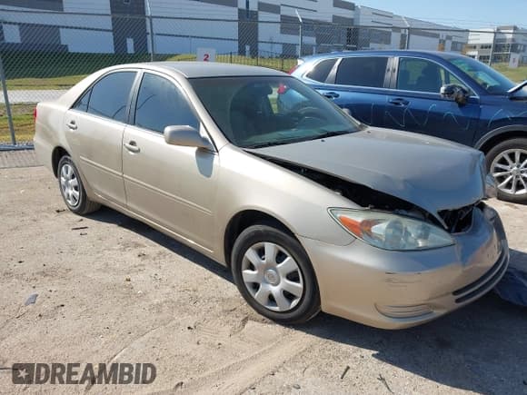 ✅ 2003 Toyota Camry LE • VIN: 4T1BE32K13U700872 • Lot: 43567879. Listed on IAAI with 202,805 mi. Free auction sales archive from the USA and detailed vehicle history report at DreamBid. Image 1.