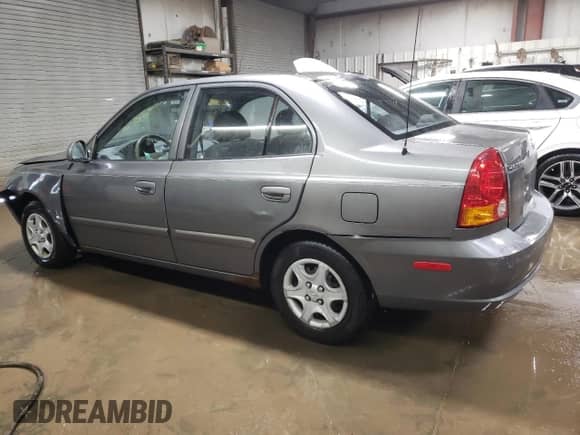 2004 Hyundai Accent GL with VIN KMHCG45C24U564570, listed as a Copart auction lot 82090484 with 69,000 mi miles and Salvage title. Bid and sale history available at DreamBid. Image 2.