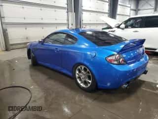 2007 Hyundai Tiburon GT z VIN KMHHN66F07U254955, wystawiony jako Copart lot #82239034 z przebiegiem 193 900 mil mil oraz Szkoda całkowita • Salvage title. Historia ofert i sprzedaży dostępna na DreamBid. Obrazek 2.
