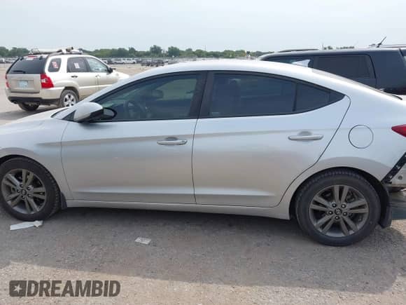 2018 Hyundai Elantra SEL z VIN 5NPD84LF6JH377163, wystawiony jako IAAI lot #43147317 z przebiegiem 147 969 mil mil oraz . Historia ofert i sprzedaży dostępna na DreamBid. Obrazek 14.