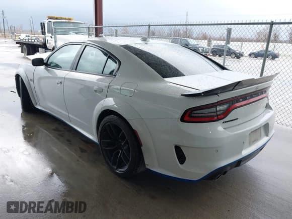 ✅ 2021 Dodge Charger Scat Pack Widebody • VIN: 2C3CDXGJ7MH579874 • Lot: 41709662. Listed on IAAI with 61,869 mi. Free auction sales archive from the USA and detailed vehicle history report at DreamBid. Image 3.