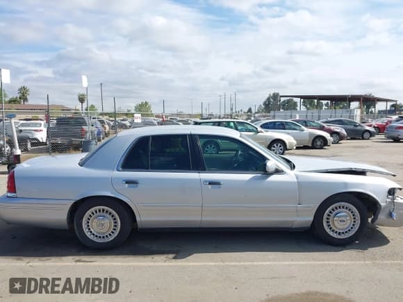 ✅ 2001 Ford Crown Victoria • VIN: 2FAFP73W31X139188 • Lot: 41883697. Listed on IAAI with 142,744 mi. Free auction sales archive from the USA and detailed vehicle history report at DreamBid. Image 14.