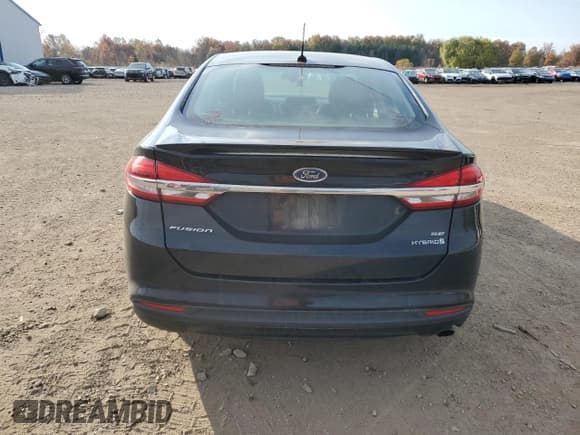 ✅ 2017 Ford Fusion Hybrid SE • VIN: 3FA6P0LU2HR356861 • Лот: 90773205. Опубликован ранее на Copart с пробегом 117 113 миль. Бесплатный доступ к архиву аукционных продаж из США и подробный отчёт об истории автомобиля на DreamBid. Изображение 6.