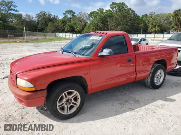 2002 Dodge Dakota Sport z VIN 1B7FL36X72S543943, wystawiony jako Copart lot #80767984 z przebiegiem Nie podano mil oraz Czysty tytuł • Clean title. Historia ofert i sprzedaży dostępna na DreamBid. Obrazek 1.