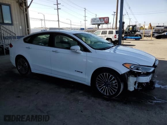 ✅ 2017 Ford Fusion Hybrid Titanium • VIN: 3FA6P0RUXHR234093 • Lot: 57997865. Wystawiony na Copart z przebiegiem 124 862 mil. Bezpłatny archiwum sprzedaży aukcyjnych z USA i szczegółowy raport historii pojazdu na DreamBid. Zdjęcie 4.