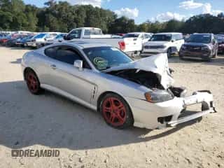 2006 Hyundai Tiburon GT z VIN KMHHN65F96U224661, wystawiony jako Copart lot #76643653 z przebiegiem 200 436 mil mil oraz Szkoda całkowita • Salvage title. Historia ofert i sprzedaży dostępna na DreamBid. Obrazek 4.