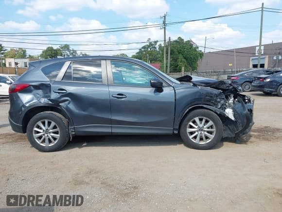 ✅ 2016 Mazda CX-5 Touring • VIN: JM3KE4CY3G0661445 • Лот: 43248250. Опубликован ранее на IAAI с пробегом 111 403 миль. Бесплатный доступ к архиву аукционных продаж из США и подробный отчёт об истории автомобиля на DreamBid. Изображение 13.