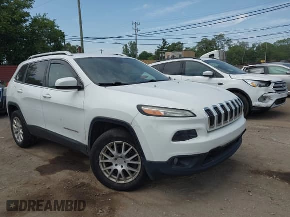 ✅ 2014 Jeep Cherokee Altitude • VIN: 1C4PJMCS2EW128356 • Lot: 42513328. Listed on IAAI with 89,884 mi. Free auction sales archive from the USA and detailed vehicle history report at DreamBid. Image 1.