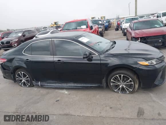 2019 Toyota Camry LE with VIN 4T1B11HK2KU833243, listed as a IAAI auction lot 42855313 with 128,404 mi miles and . Bid and sale history available at DreamBid. Image 13.