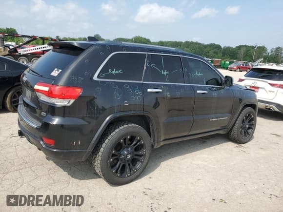 ✅ 2014 Jeep Grand Cherokee Overland • VIN: 1C4RJFCG6EC547604 • Lot: 55824944. Listed on Copart with 128,330 mi. Free auction sales archive from the USA and detailed vehicle history report at DreamBid. Image 3.