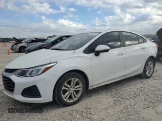✅ 2019 Chevrolet Cruze LS • VIN: 1G1BC5SMXK7102289 • Lot: 86277365. Listed on Copart with 145,500 mi. Free auction sales archive from the USA and detailed vehicle history report at DreamBid. Image 1.