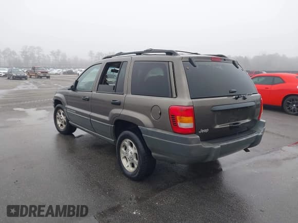 ✅ 1999 Jeep Grand Cherokee Laredo • VIN: 1J4G258S2XC768349 • Lot: 41305102. Listed on IAAI with 136,848 mi. Free auction sales archive from the USA and detailed vehicle history report at DreamBid. Image 3.