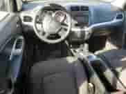 2013 Dodge Journey American Value with VIN 3C4PDCAB5DT597224, listed as a Copart auction lot 82536665 with 104,666 mi miles and Clean title. Bid and sale history available at DreamBid. Image 8.