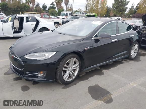 ✅ 2015 Tesla Model S 85 • VIN: 5YJSA1E16FF107254 • Lot: 43741109. Listed on IAAI with 119,933 mi. Free auction sales archive from the USA and detailed vehicle history report at DreamBid. Image 2.