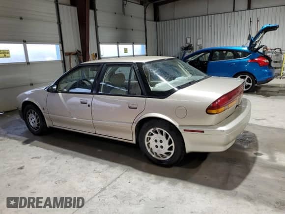 1995 Saturn SL с VIN 1G8ZK5271SZ238117, выставлен на аукционе Copart как лот 83723624 с пробегом 80 535 миль миль и Чистый • Clean title. История ставок и продаж доступна на DreamBid. Изображение 2.
