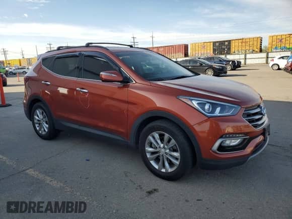 2017 Hyundai Santa Fe 2.0T z VIN 5XYZUDLA7HG490689, wystawiony jako Copart lot #53673385 z przebiegiem 131 435 mil mil oraz Szkoda całkowita • Salvage title. Historia ofert i sprzedaży dostępna na DreamBid. Obrazek 4.