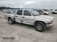 2003 Dodge Dakota SLT z VIN 1D7HL48X13S151334, wystawiony jako Copart lot #82016764 z przebiegiem 216 281 mil mil oraz Szkoda całkowita • Salvage title. Historia ofert i sprzedaży dostępna na DreamBid. Obrazek 4.
