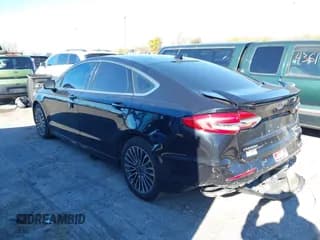 ✅ 2020 Ford Fusion Titanium • VIN: 3FA6P0D98LR174391 • Lot: 43470790. Listed on IAAI with 74,718 mi. Free auction sales archive from the USA and detailed vehicle history report at DreamBid. Image 3.