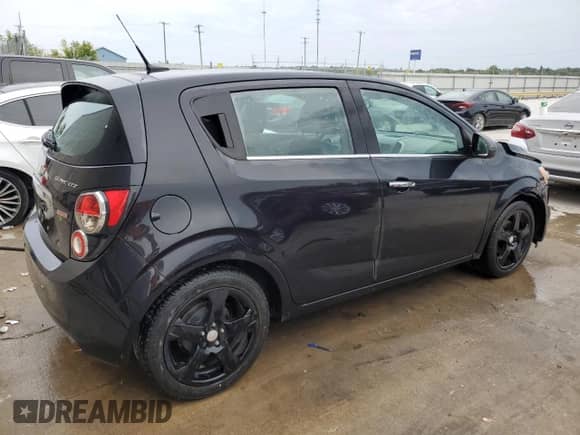 2013 Chevrolet Sonic LTZ с VIN 1G1JF6SB5D4152982, выставлен на аукционе Copart как лот 70643904 с пробегом 144 912 миль миль и Списание • Salvage title. История ставок и продаж доступна на DreamBid. Изображение 3.