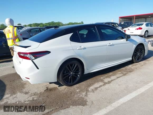 2021 Toyota Camry Hybrid XSE with VIN 4T1K31AK4MU024933, listed as a IAAI auction lot 42316758 with 97,630 mi miles and . Bid and sale history available at DreamBid. Image 4.