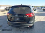 ✅ 2014 Mazda CX-5 Grand Touring • VIN: JM3KE2DY7E0345255 • Lot: 43668720. Listed on IAAI with 270,412 mi. Free auction sales archive from the USA and detailed vehicle history report at DreamBid. Image 16.