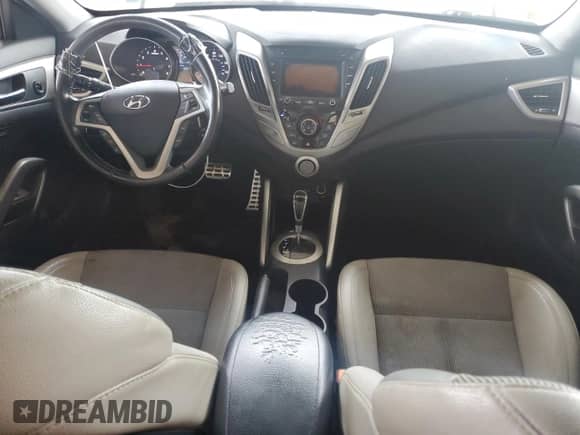 ✅ 2014 Hyundai Veloster • VIN: KMHTC6AD0EU206861 • Лот: 76593534. Размещён на Copart с пробегом 127 671 миль миль. Получите бесплатный доступ к архиву аукционных продаж из США и посмотрите подробный отчёт об истории автомобиля на DreamBid. Изображение 8.