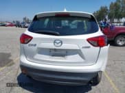 ✅ 2016 Mazda CX-5 Sport • VIN: JM3KE2BY5G0793032 • Lot: 42128706. Listed on IAAI with 52,010 mi. Free auction sales archive from the USA and detailed vehicle history report at DreamBid. Image 16.