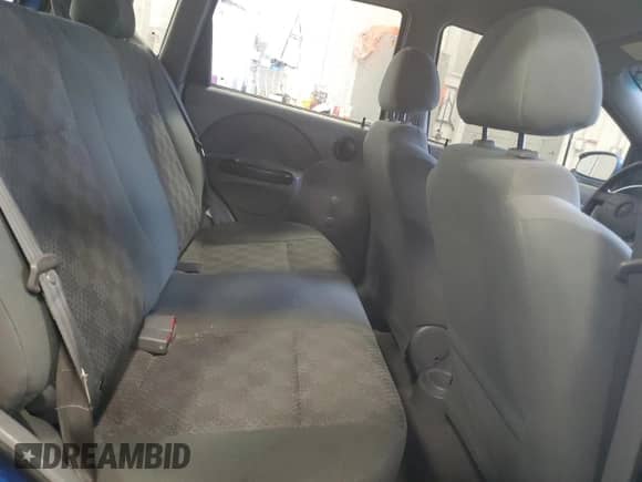 2005 Chevrolet Aveo LS z VIN KL1TD626X5B293852, wystawiony jako Copart lot #86274464 z przebiegiem 150 052 mil mil oraz Nie do naprawy • Non repairable. Historia ofert i sprzedaży dostępna na DreamBid. Obrazek 10.