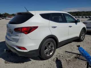 2018 Hyundai Santa Fe 2.4L z VIN 5NMZT3LBXJH077926, wystawiony jako Copart lot #86124935 z przebiegiem 193 067 mil mil oraz Szkoda całkowita • Salvage title. Historia ofert i sprzedaży dostępna na DreamBid. Obrazek 3.