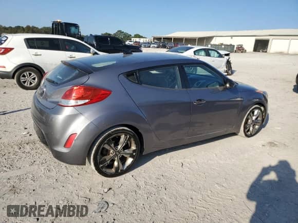 2015 Hyundai Veloster z VIN KMHTC6AD0FU221104, wystawiony jako Copart lot #75229514 z przebiegiem 136 469 mil mil oraz Czysty tytuł • Clean title. Historia ofert i sprzedaży dostępna na DreamBid. Obrazek 3.