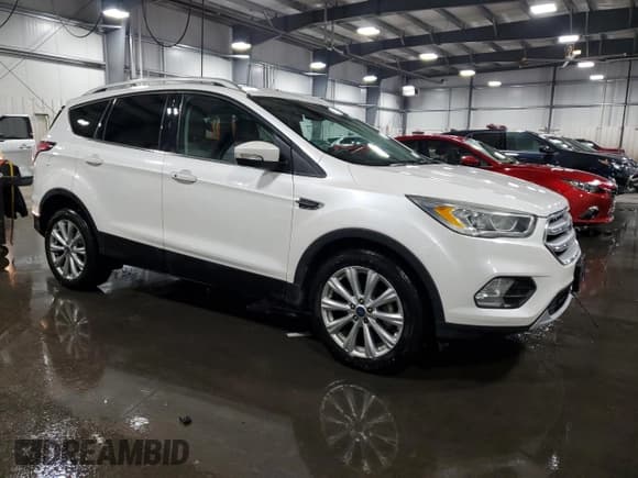 ✅ 2017 Ford Escape Titanium • VIN: 1FMCU0JD3HUD40648 • Lot: 90056455. Wystawiony na Copart z przebiegiem 69 569 mil. Bezpłatny archiwum sprzedaży aukcyjnych z USA i szczegółowy raport historii pojazdu na DreamBid. Zdjęcie 4.